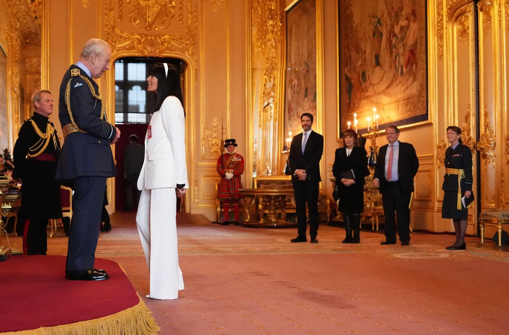 Claudia's family watch from the sidelines