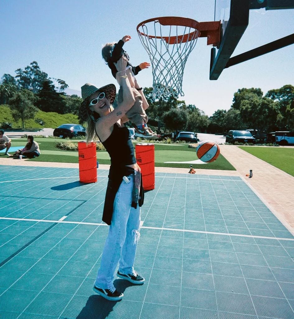 Behati and her son playing basketball