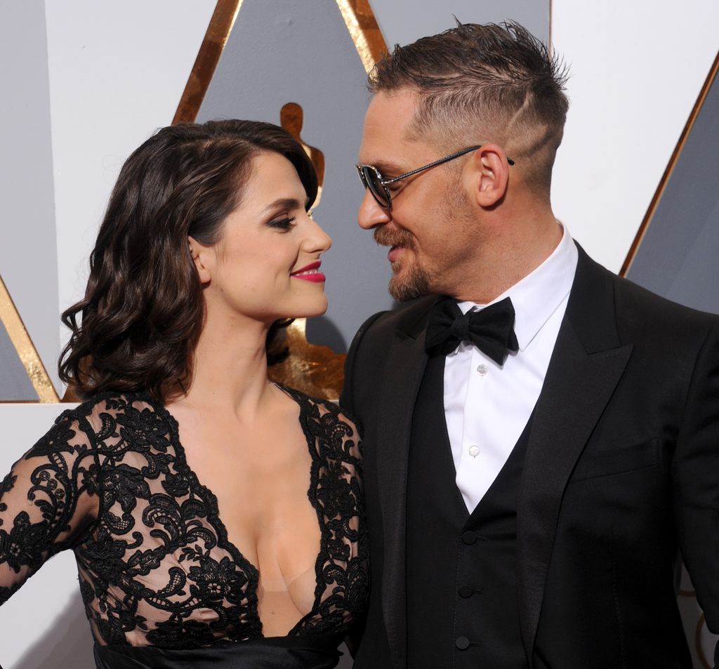   Actor Tom Hardy and Charlotte Riley arrive at the 88th Annual Academy Awards at Hollywood & Highland Center on February 28, 2016 in Hollywood