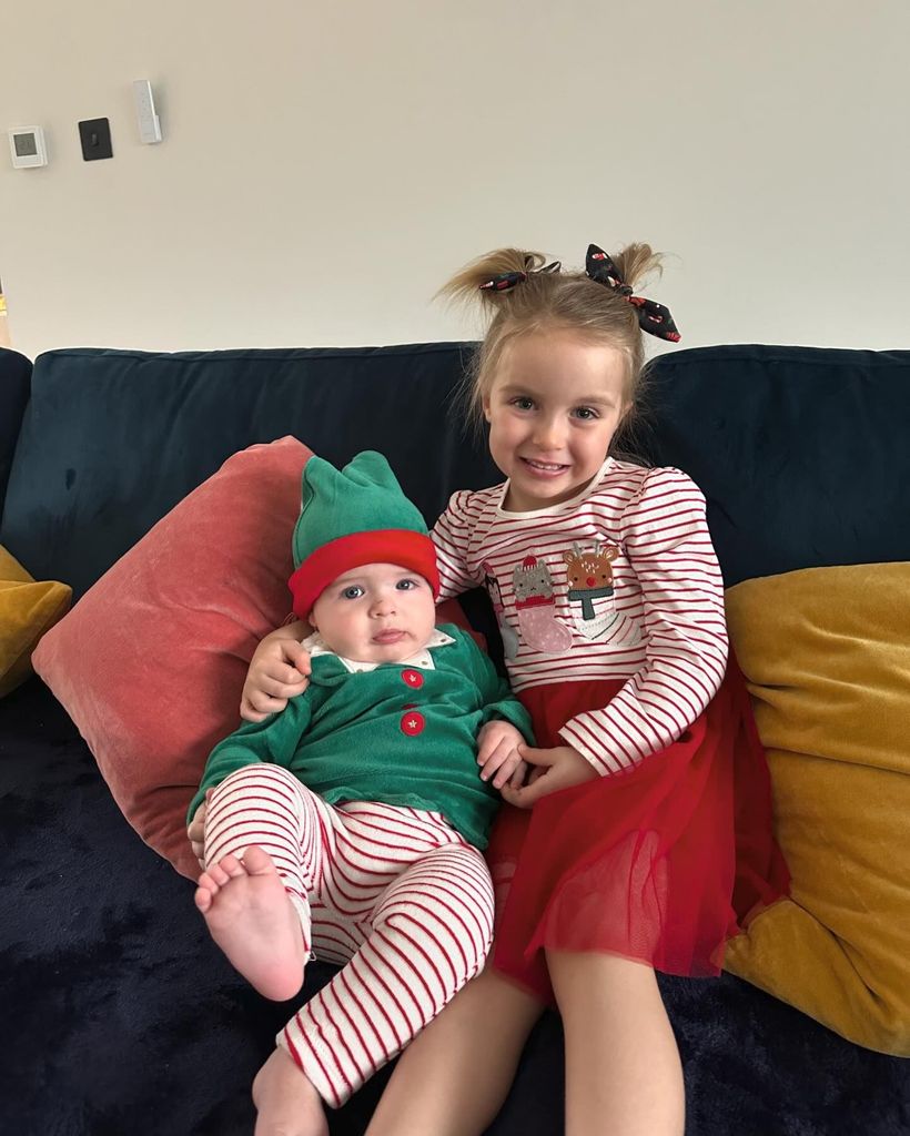 brother and sister in festive outfits 