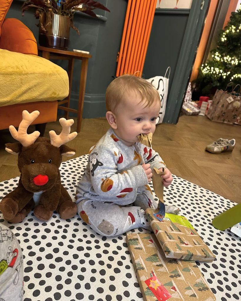 baby wearing christmas pyjamas