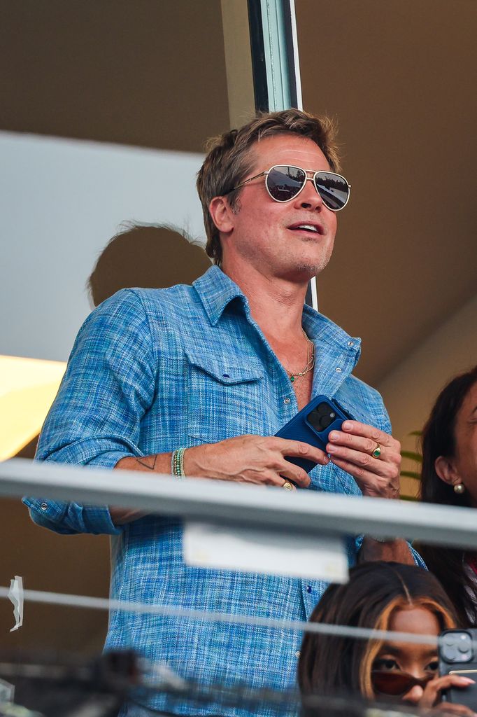 brad pitt in blue shirt seen at the F1 Grand Prix in Mexico