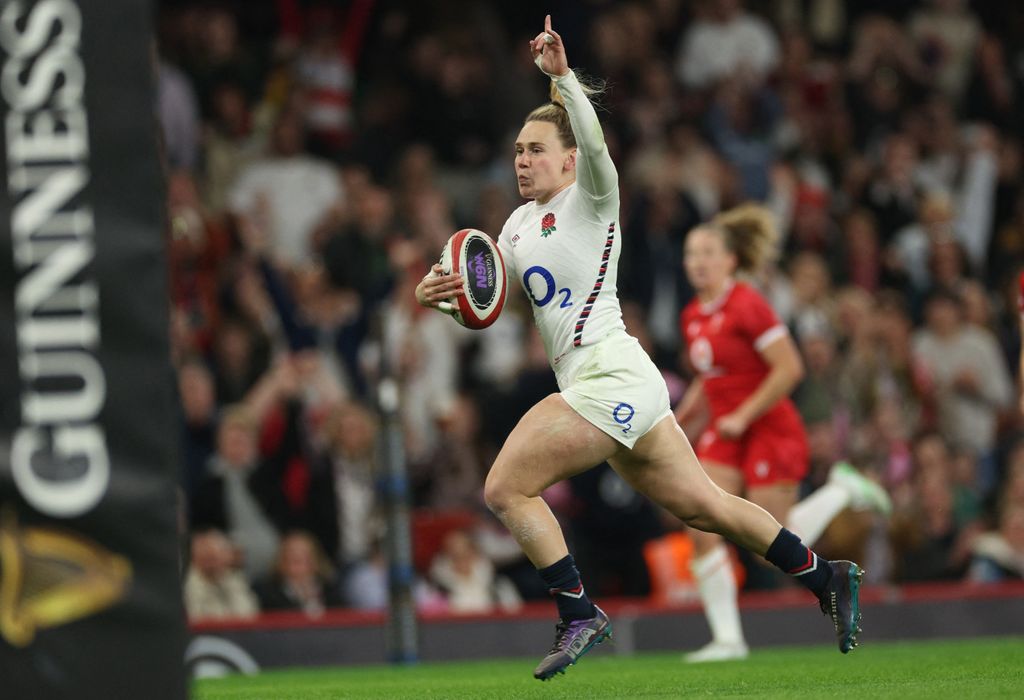 Megan Jones runs in rugby kit