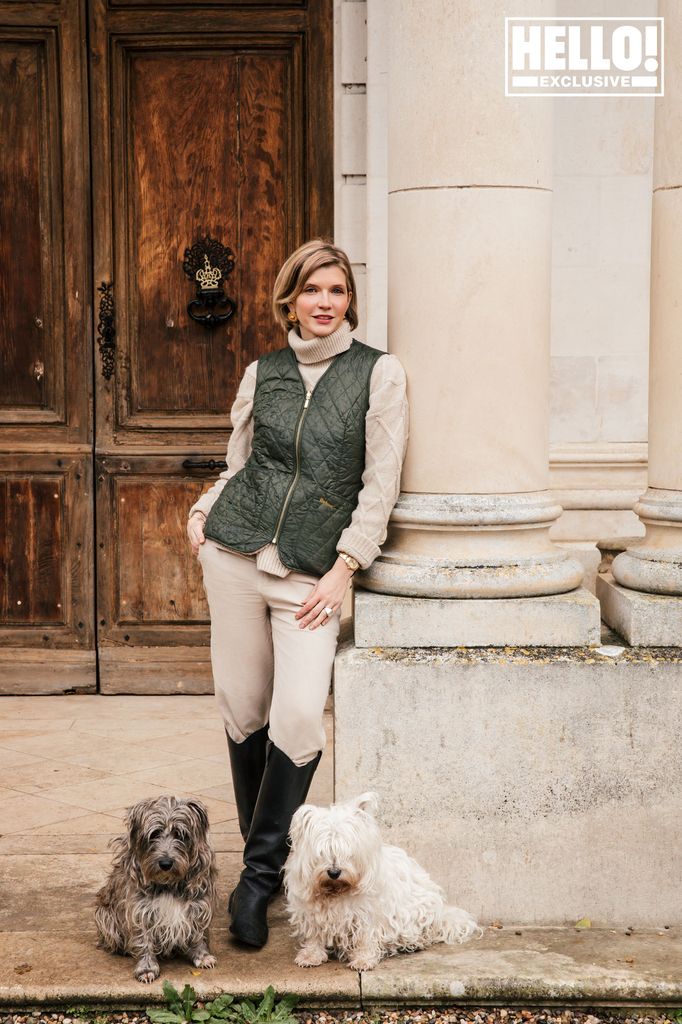 Catherine Roger posing with dogs at Chateau Marcellus near Bordeaux