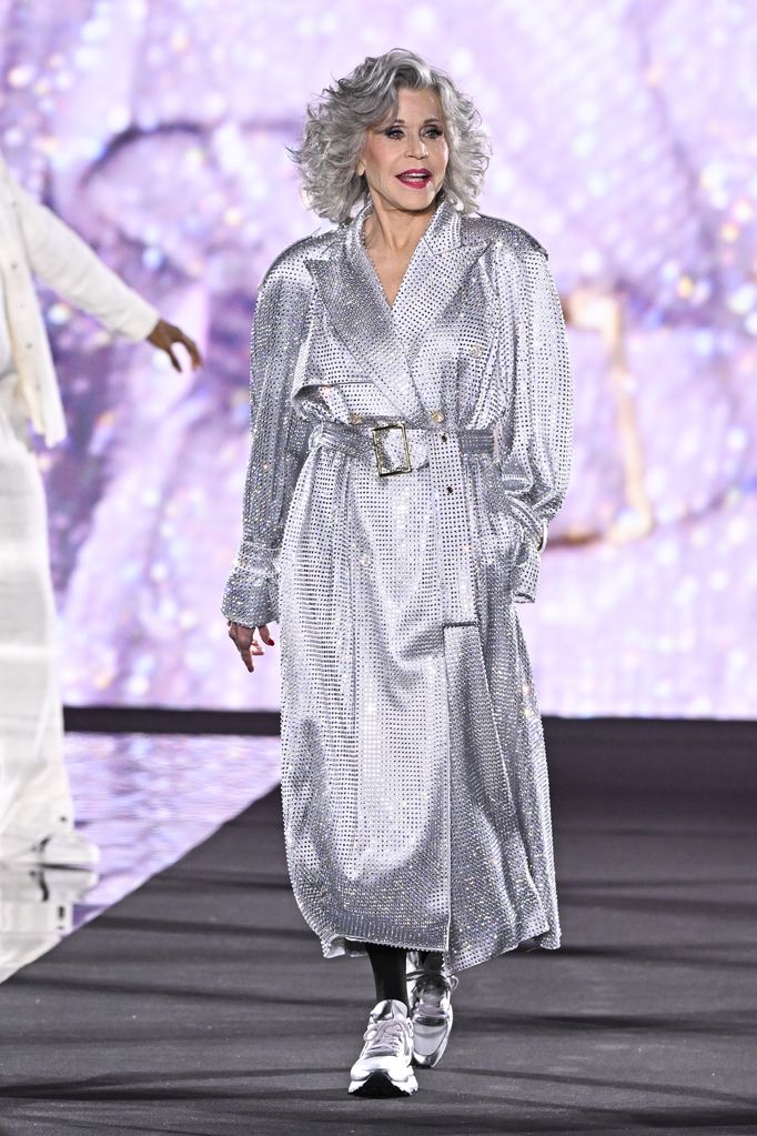 Jane Fonda wearing a silver mac at the L'Oreal show