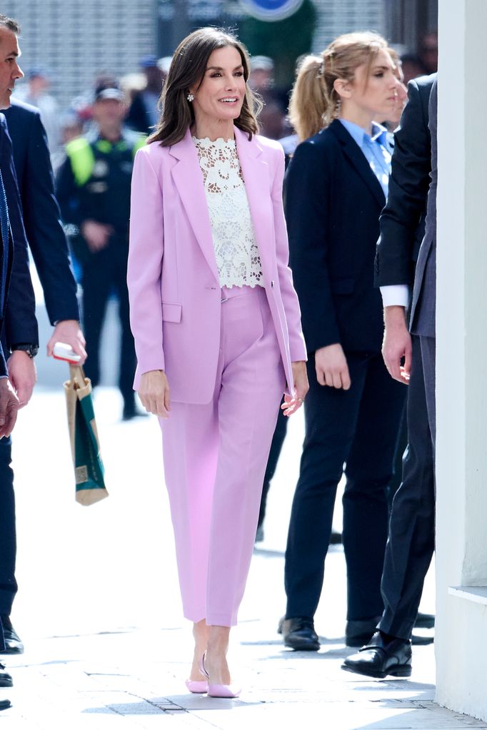 Letizia smiling in lilac suit and white top