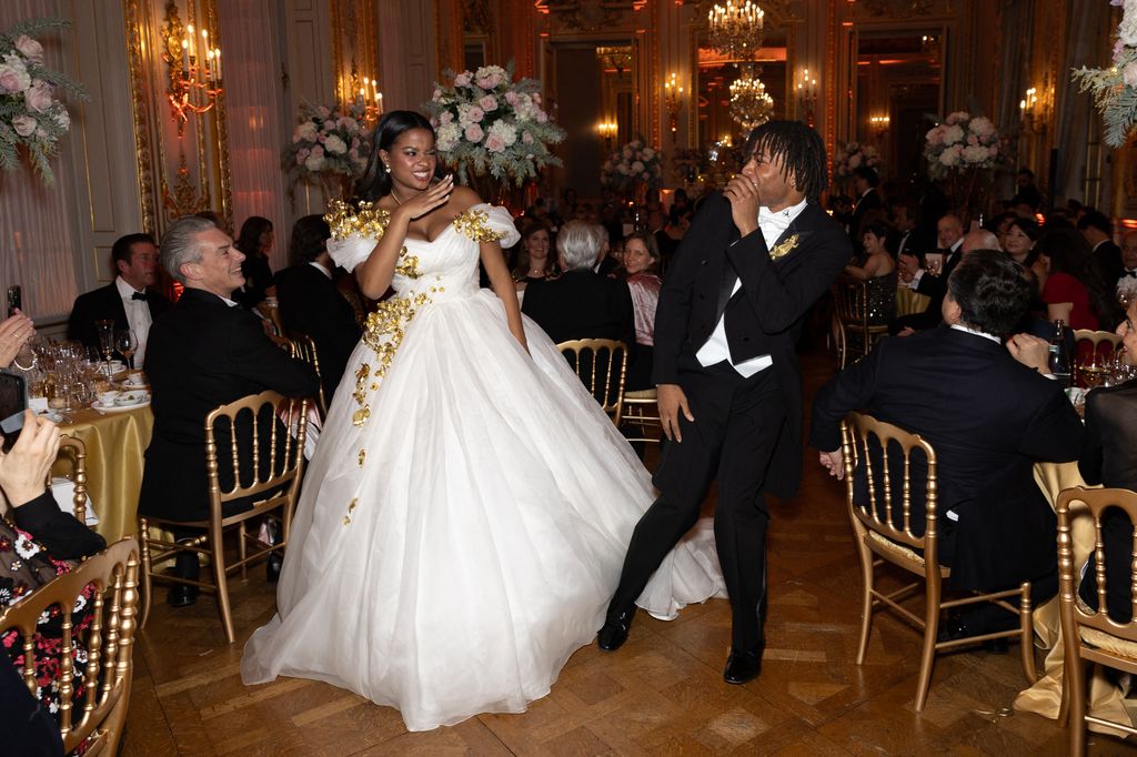 Bronwyn Vance and her cavalier Slater Vance dance playfully at ball