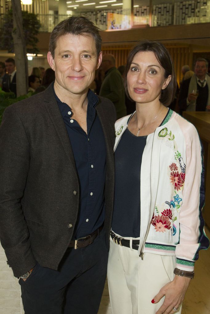 Ben Shephard in a blue shirt with his wife Annie in a white cardi