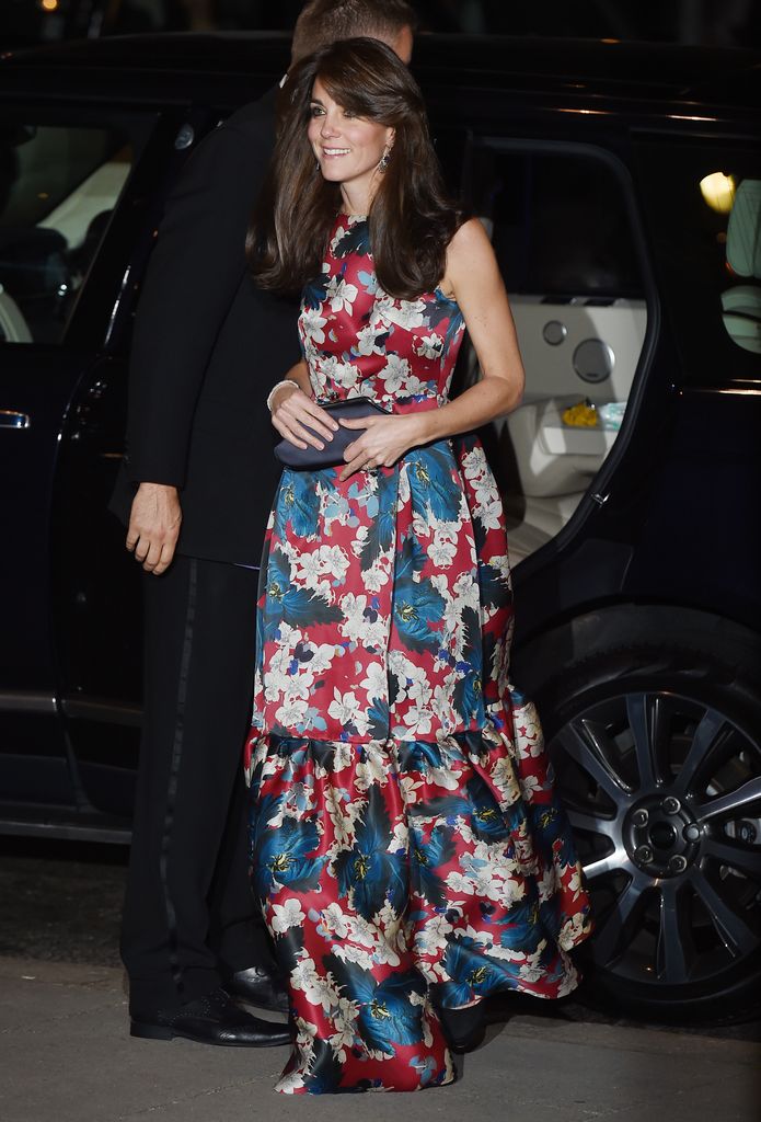 Kate exiting car in blue and red floral dress