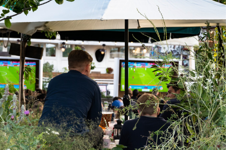 men watching football in pub garden