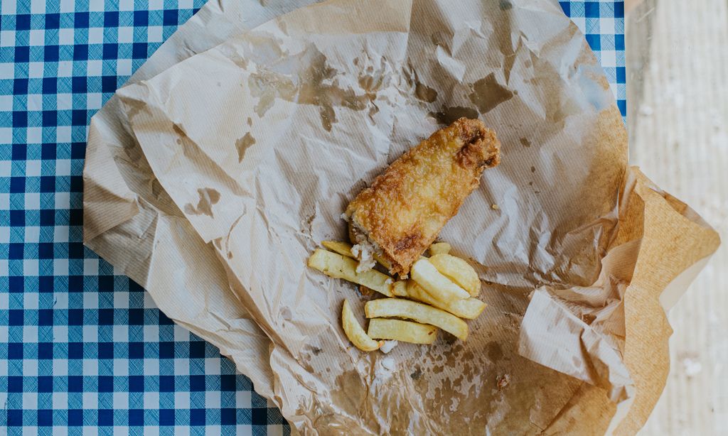Fish and chips on greasy brown paper