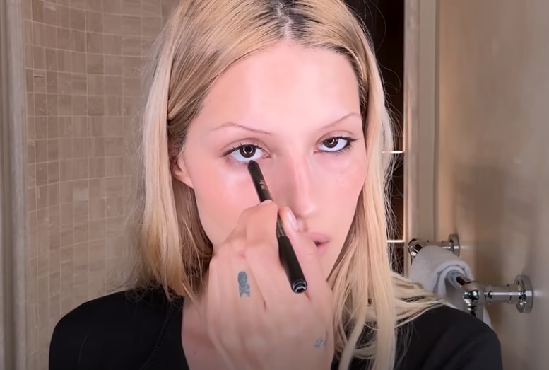 Gabbriette Bechtel applying eyeliner