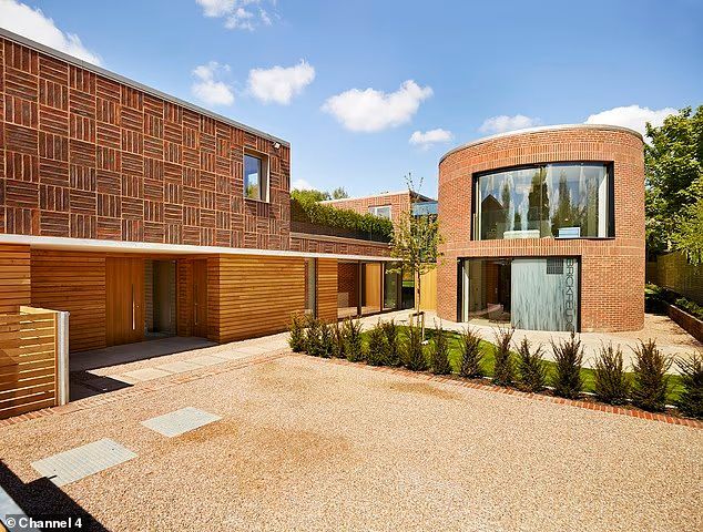 brick home with adjoining 'kiln' shaped building