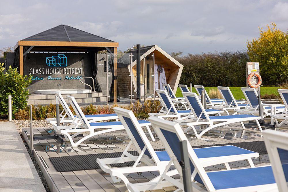 The decking/sunlounger area at The Glass House Retreat