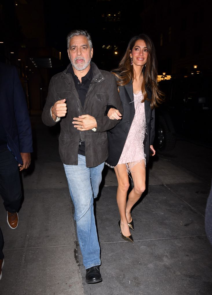 NEW YORK, NEW YORK - DECEMBER 13: George Clooney and Amal Clooney arrive to the Polo Bar on December 13, 2023 in New York City. (Photo by James Devaney/GC Images)