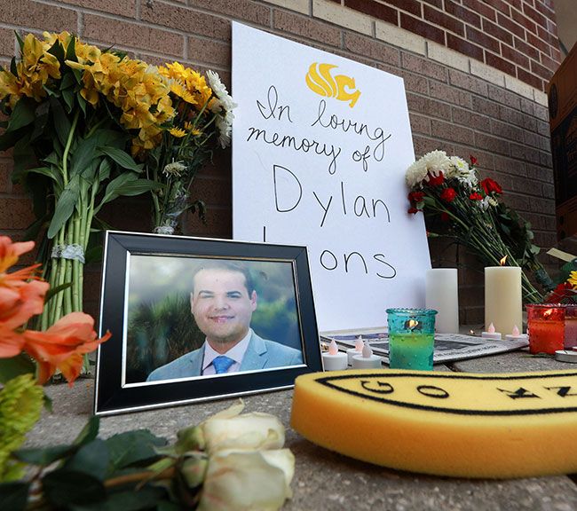 Tributes for reporter Dylan Lyons including flowers and photographs