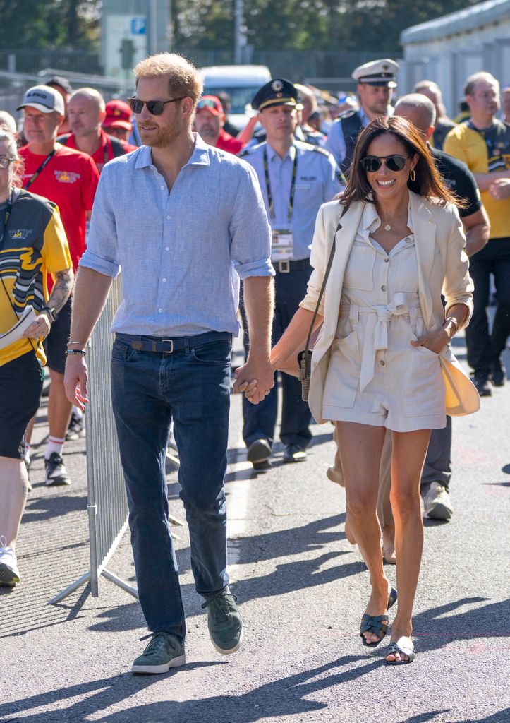 Prince Harry and Meghan markle walk hand in hand