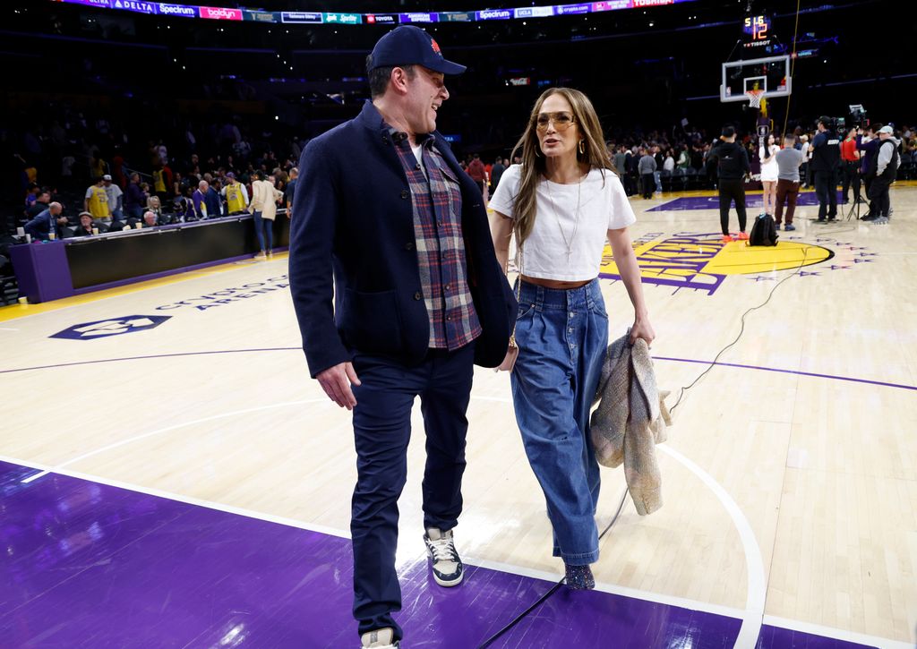 JLo on basketball court with ben in baggy jeans
