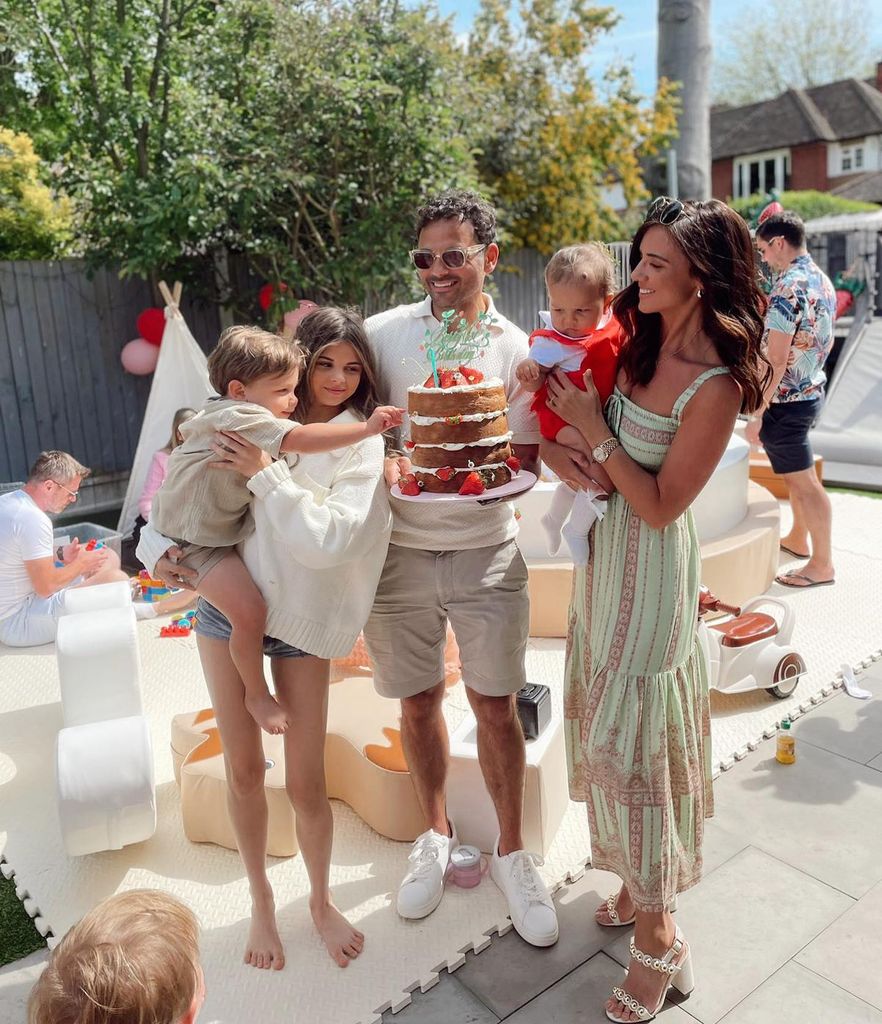 Ryan with his three children and wife in garden