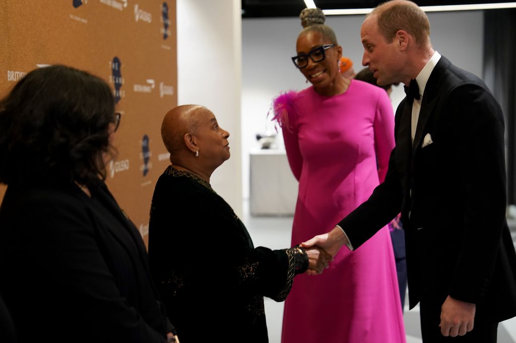 Prince William shaking Doreen Lawrence's hand
