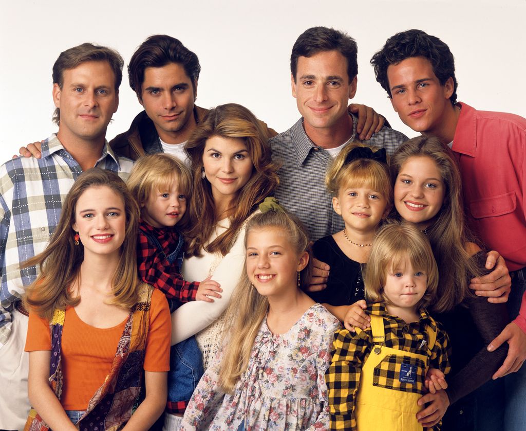 Pictured, from left: Dave Coulier (Joey), Andrea Barber (Kimmy), John Stamos (Jesse), Blake Tuomy-Wilhoit (Nicky), Lori Loughlin (Rebecca), Jodie Sweetin (Stephanie), Bob Saget (Danny), Ashley Olsen (Michelle), Dylan Tuomy-Wilhoit (Alex), Candace Cameron (D.J.), Scott Weinger (Steve) on Full House, 1993