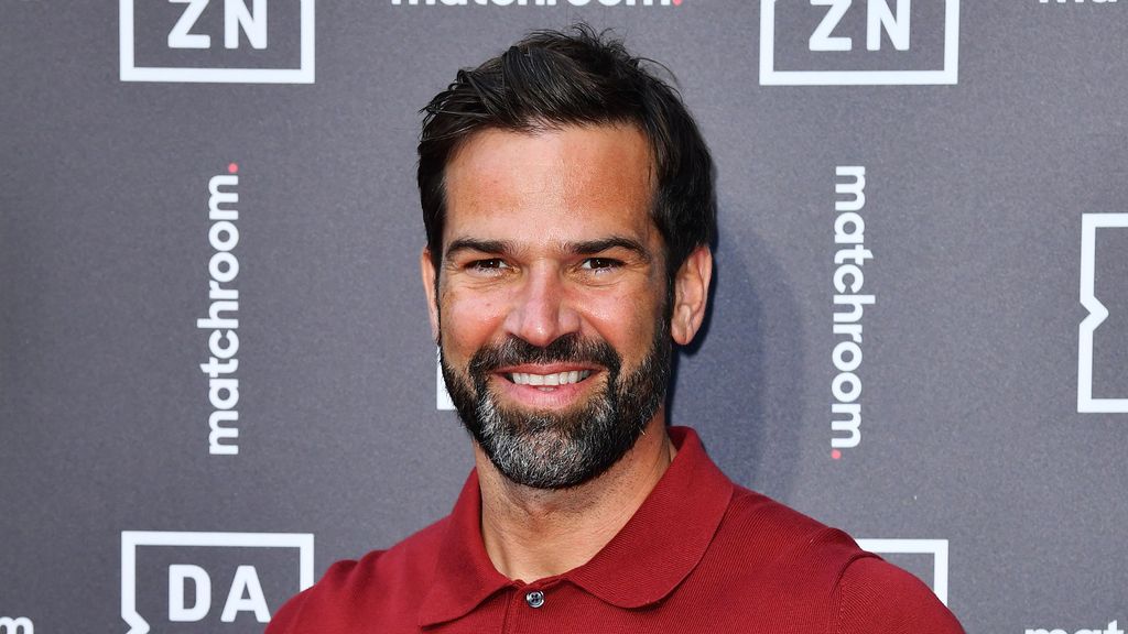 Gethin Jones wears a red shirt 