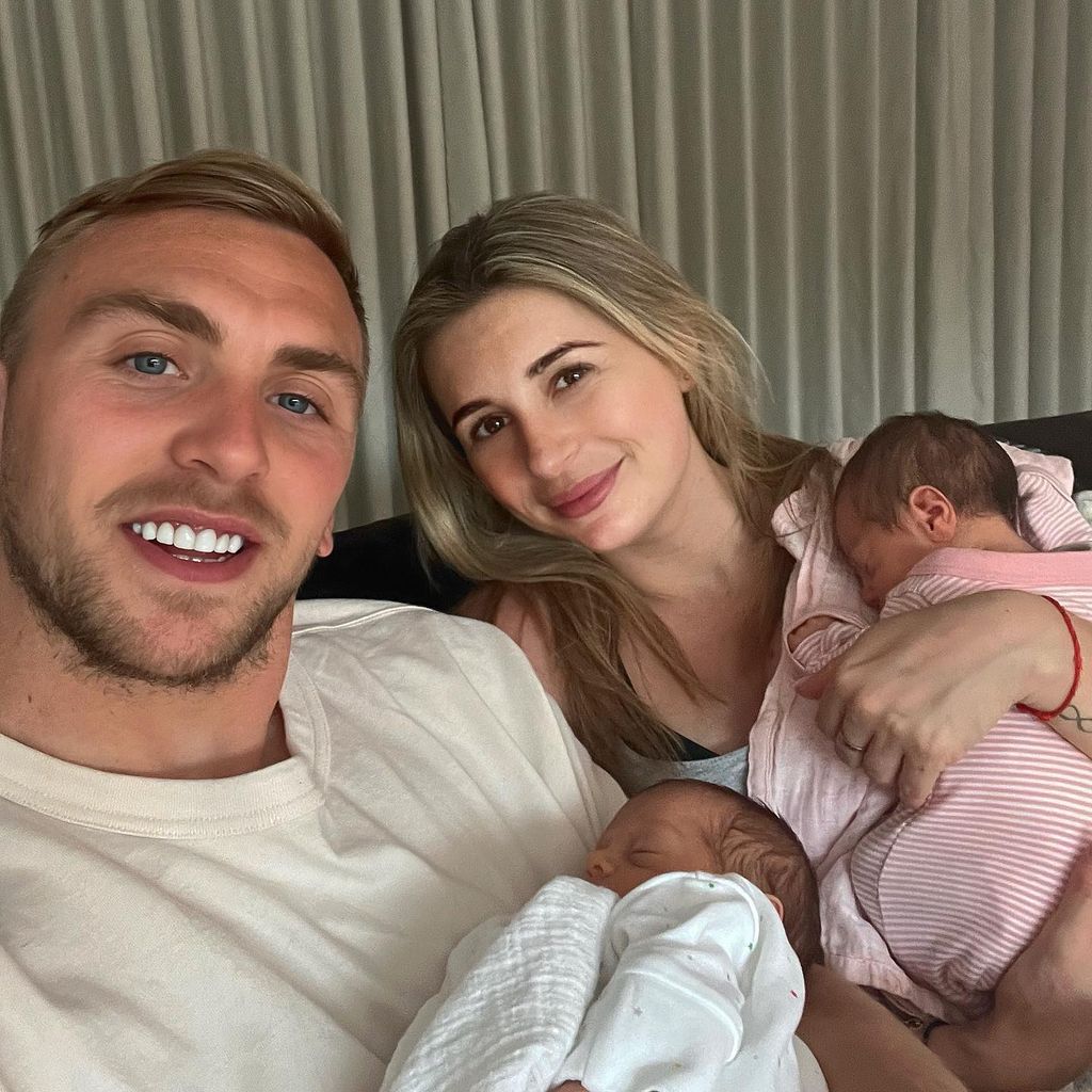 Dani Dyer and Jarrod Bowen holding a baby each