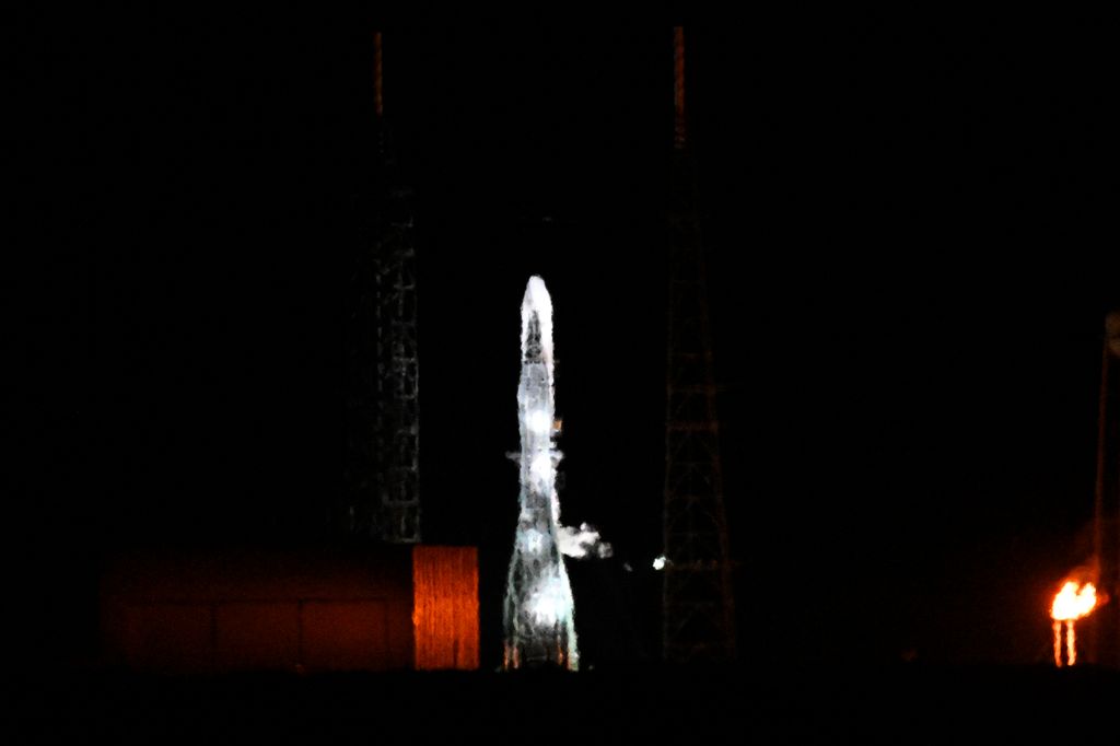 Blue Origin New Glenn rocket sits at Launch Complex 36 after its scheduled early morning launch was cancelled at Cape Canaveral Space Force Station on January 13 in Cape Canaveral, Florida. The long-delayed inaugural uncrewed NG-1 mission would help pave the way for the Jeff Bezos-founded space company to compete against Elon Musk's SpaceX.