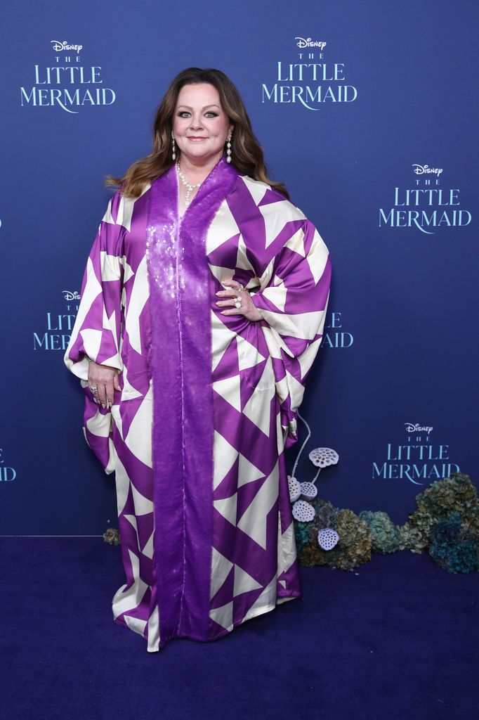 Melissa in a purple and white patterned dress