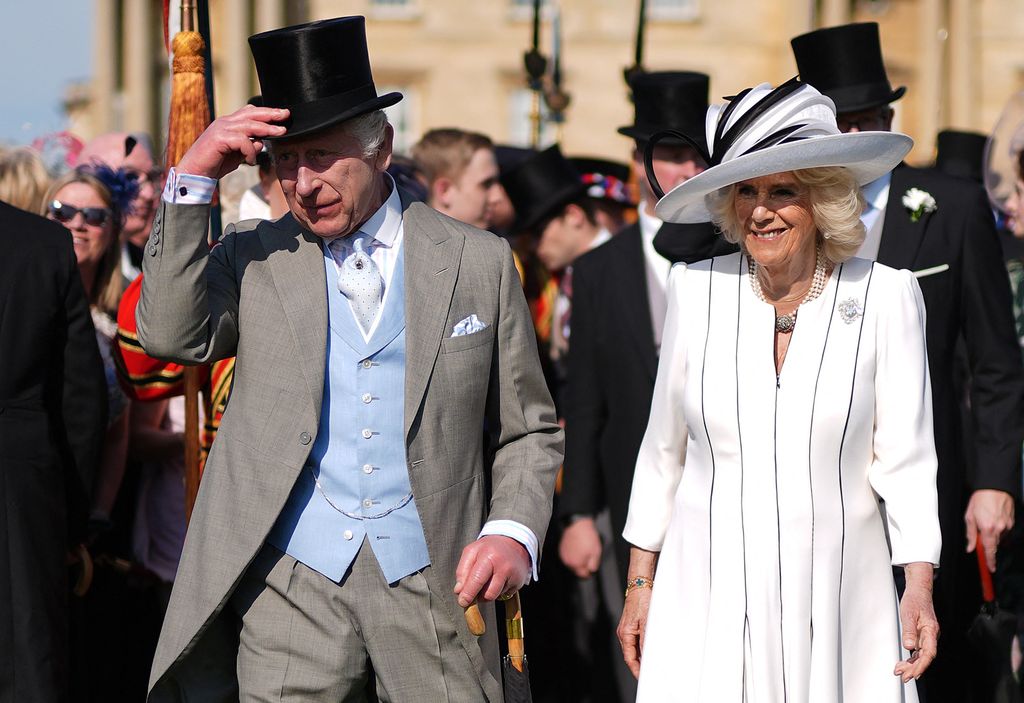 King Charles III and Britain's Queen Camilla attend a Royal Garden Party at Buckingham Palace, central London, on May 8, 2024. (Photo by Jordan Pettitt / POOL / AFP) (Photo by JORDAN PETTITT/POOL/AFP via Getty Images)