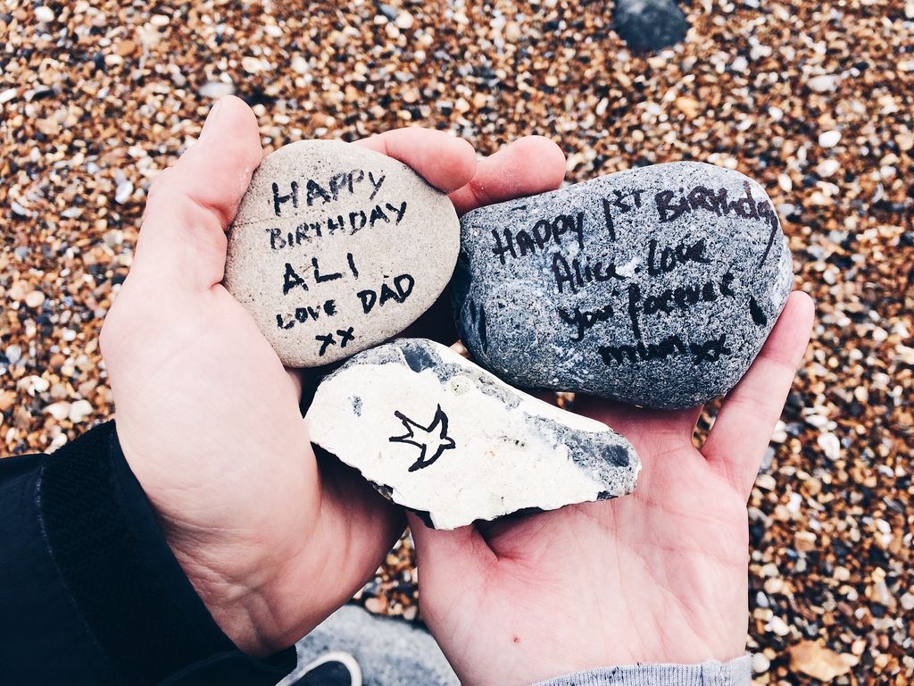 Stones with writing on in tribute to Sarah's beautiful daughter Alice 