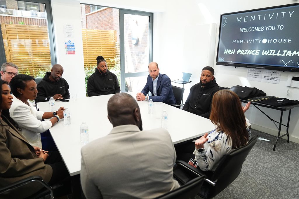 Prince William sitting around a table at Mentivity community centre