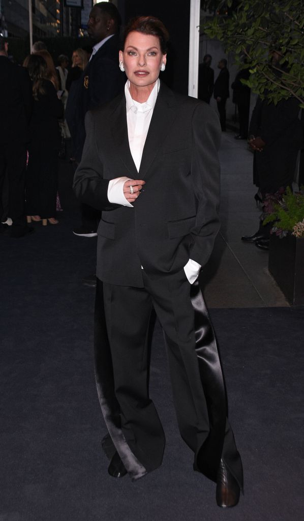 linda evangelist in slick tuxedo for fashion week bash