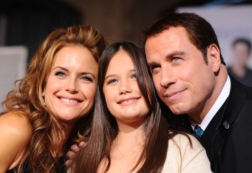 Kelly Preston, Ella Bleu Travolta and John Travolta arrive at the premiere of Walt Disney Pictures' "Old Dogs" held at the El Capitan Theatre on November 9, 2009 in Hollywood, California.