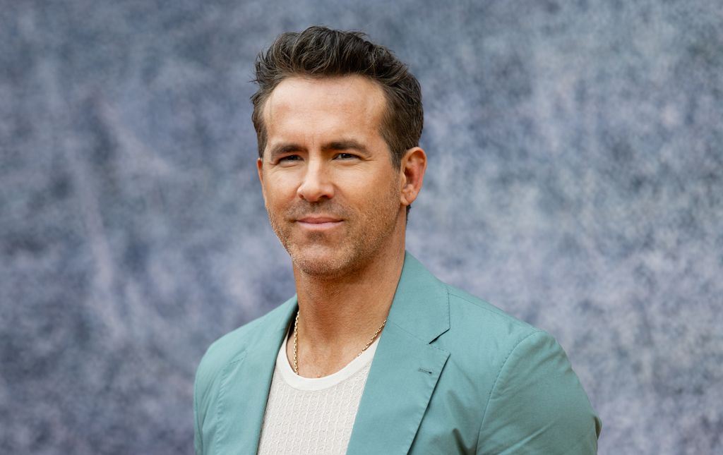 photo of ryan reynolds in green suit