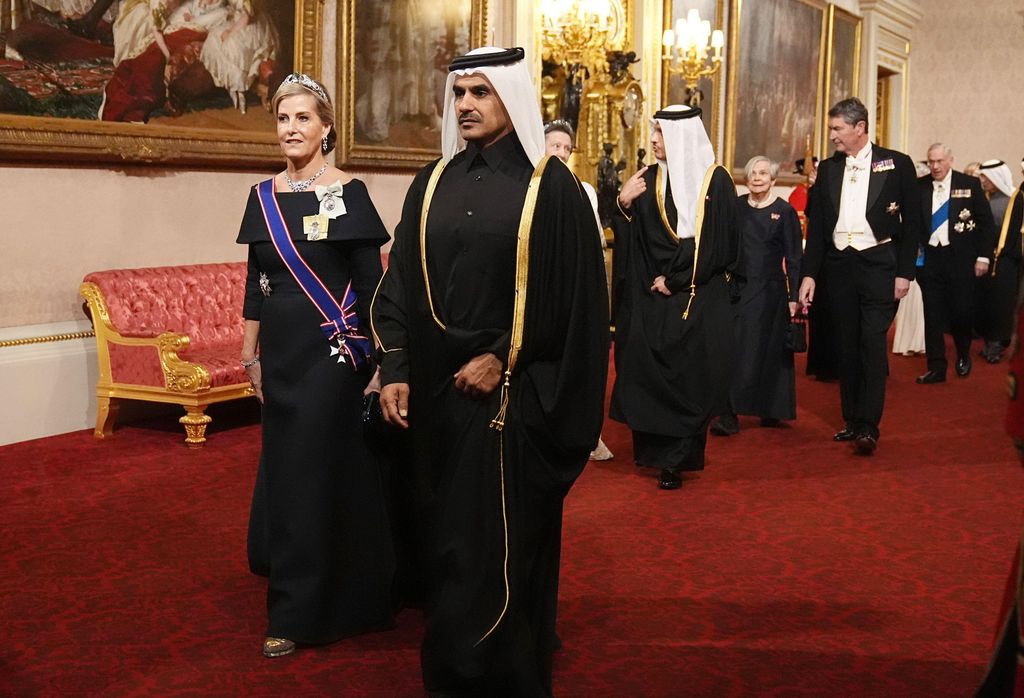 Duchess Sophie in a black dress walking alongside Saad bin Sherida Al Kaabi