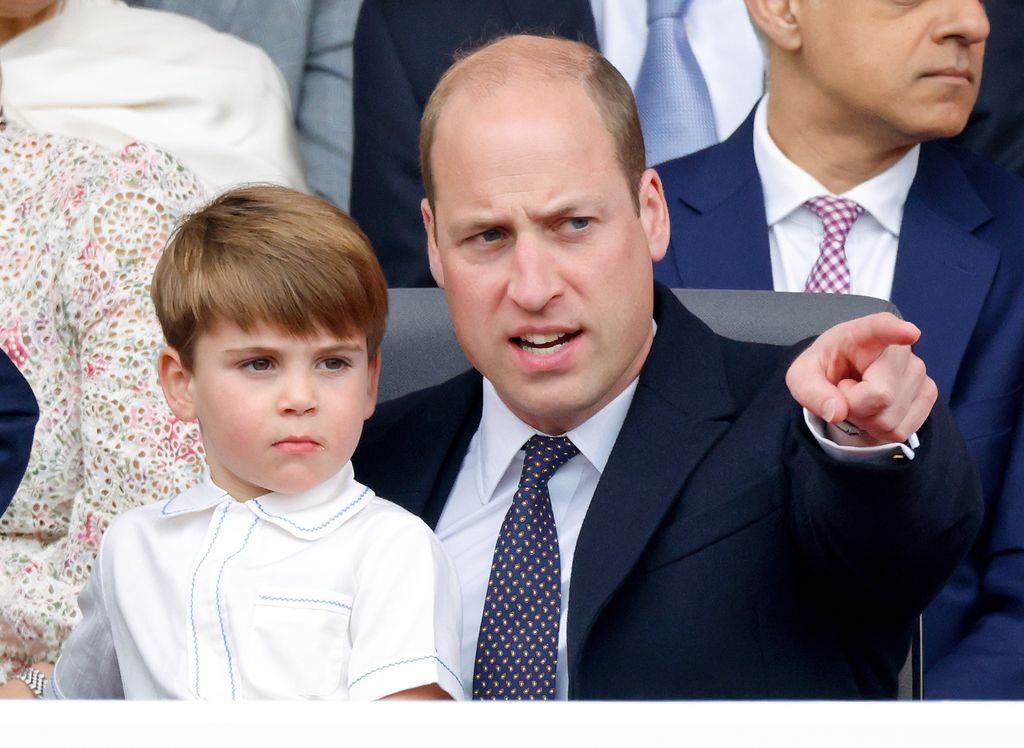 Prince Louis sitting on Prince William's lap