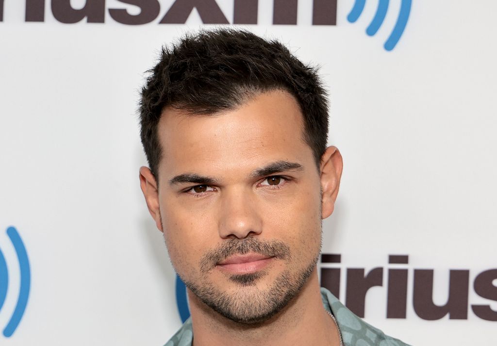 Taylor Lautner in a green shirt 