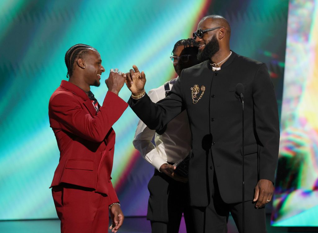 Bronny James and Bryce James present the LeBron James with the Best Record-Breaking Performance award onstage during The 2023 ESPY Awards 
