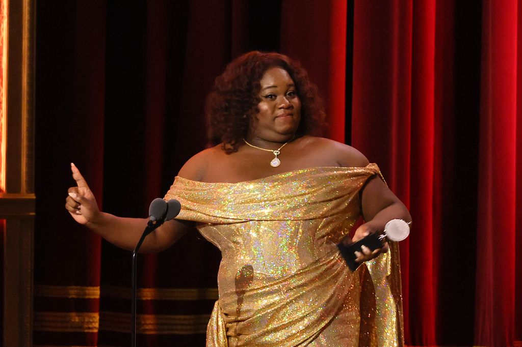Alex Newell accepts the award for Best Featured Actor in a Musical for Shucked onstage during The 76th Annual Tony Awards at United Palace Theater on June 11, 2023 in New York City