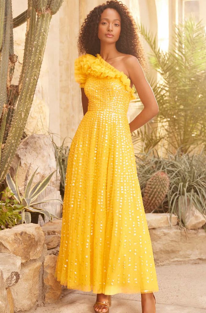 model wearing needle and thread yellow one-shouldered dress