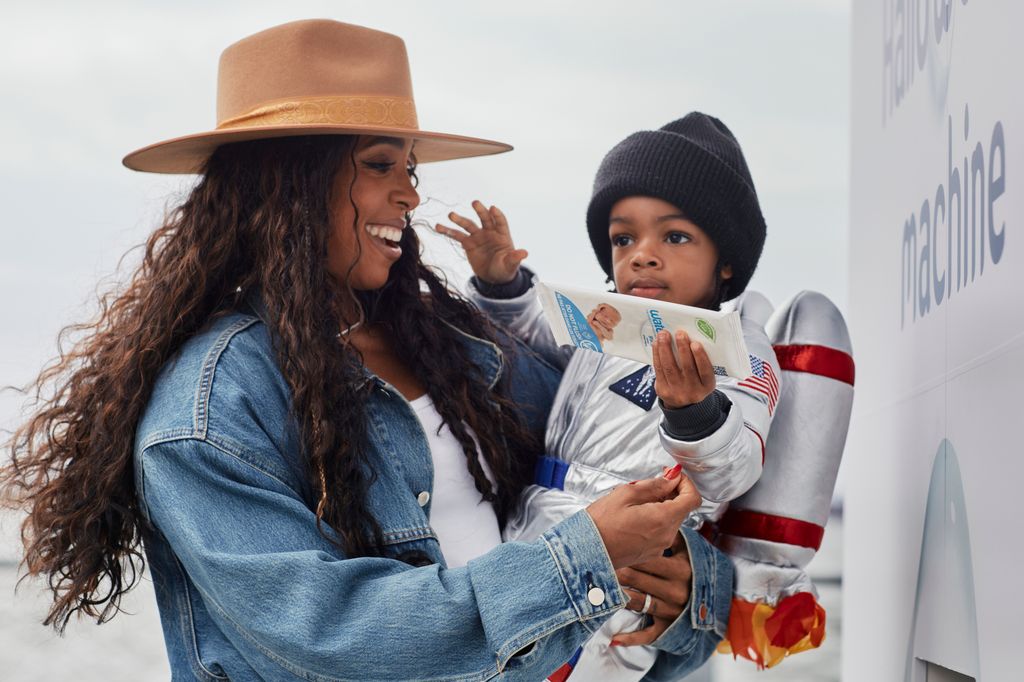 Kelly Rowland and her son Noah, two, at the Brooklyn Harvest Festival on October 21 where they tested the WaterWipes Hallowclean Machine.
