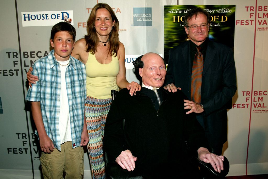 Robin Williams (R) poses with actor Christopher Reeve, wife Dana Reeve and son Will (L) at the screening of "House Of D" in 2004