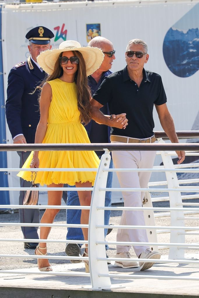 eorge Clooney and wife Amal are seen arriving at Marco Polo Airport in Venice for the 81st Venice International Film Festival.