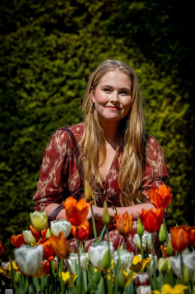 princess amalia posing with tulips in garden