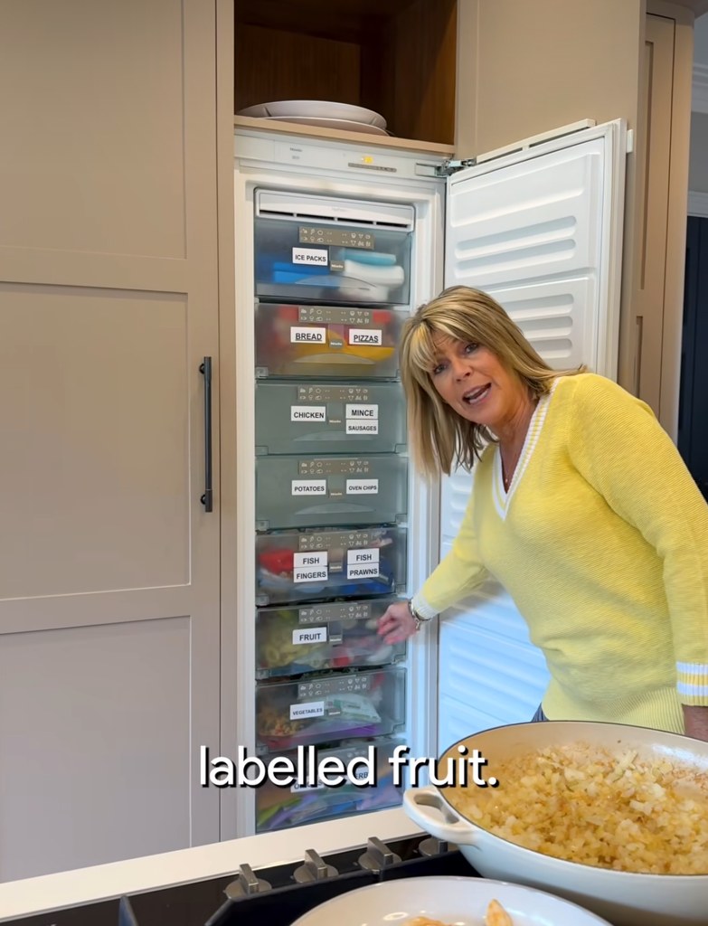 woman pointing at labelled freezer