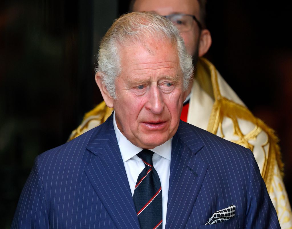 King Charles in blue pinstripe suit 