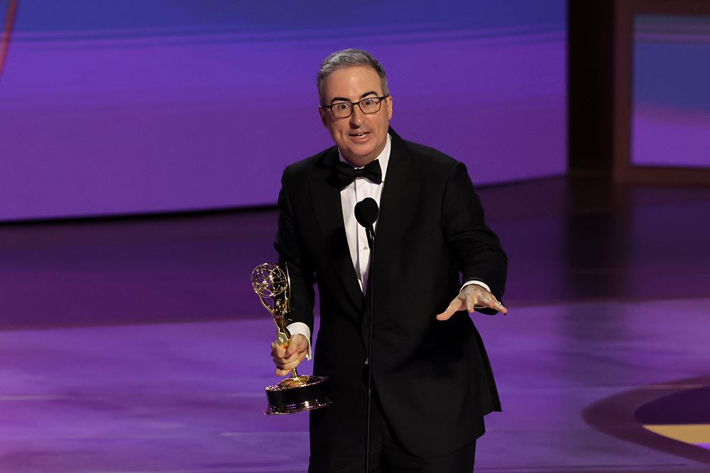 John Oliver with his Emmy award 