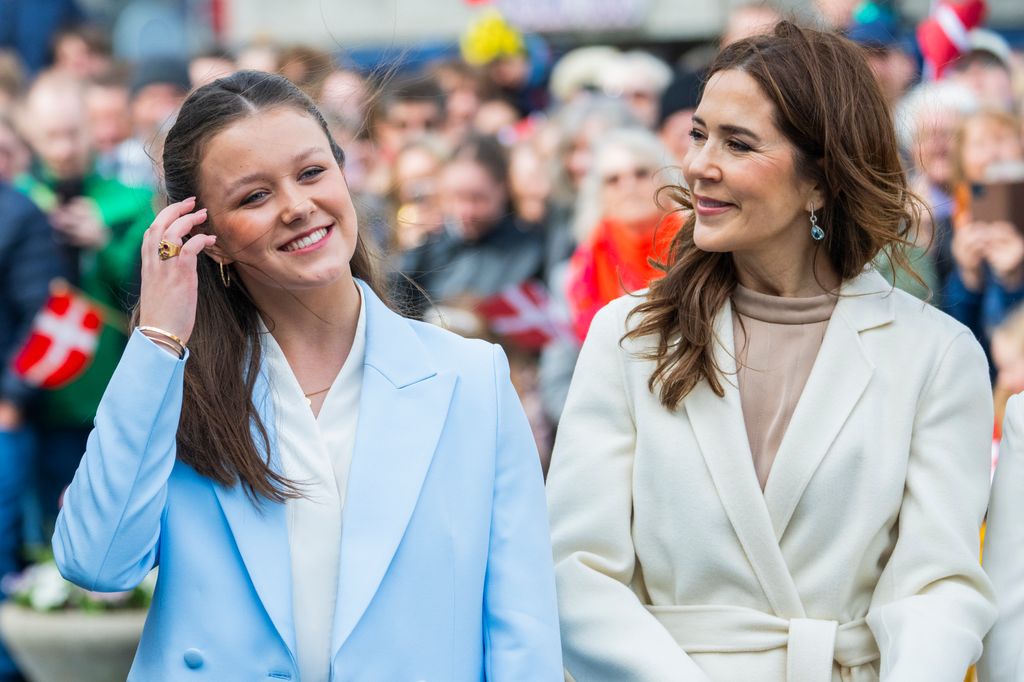 Queen Mary smiling at Princess Isabella in blue suit