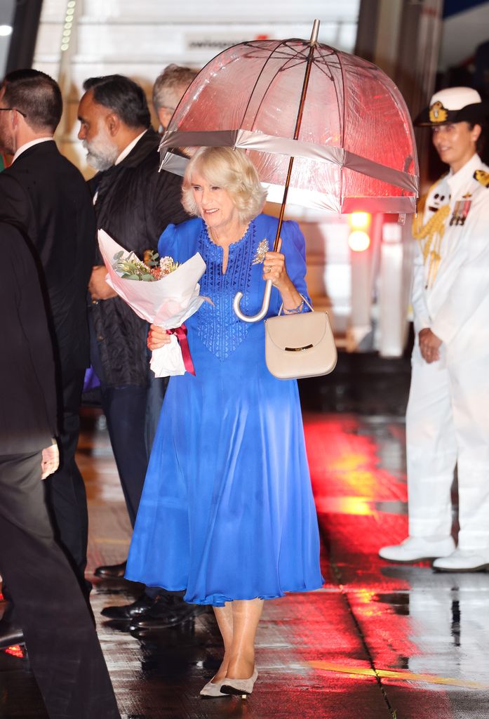 Camilla was presented with a posy by 12-year-old Ky, from Adelaide, whose wish to meet the King and Queen was being granted by the Make-A-Wish Foundation.